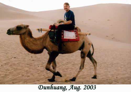 Bill on a camel in the Dunhuang area desert