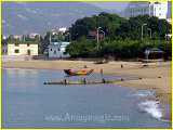 south fujian fishing boat pulled up to shore to sell fish