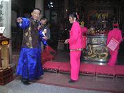 A ceremony in Meizhou Island's Mazu Temple participants wearing traditional Chinese costumes