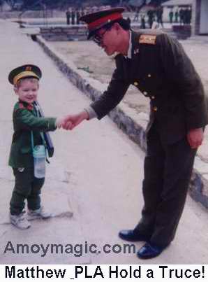 Matthew in PLA uniform making friends with a soldier